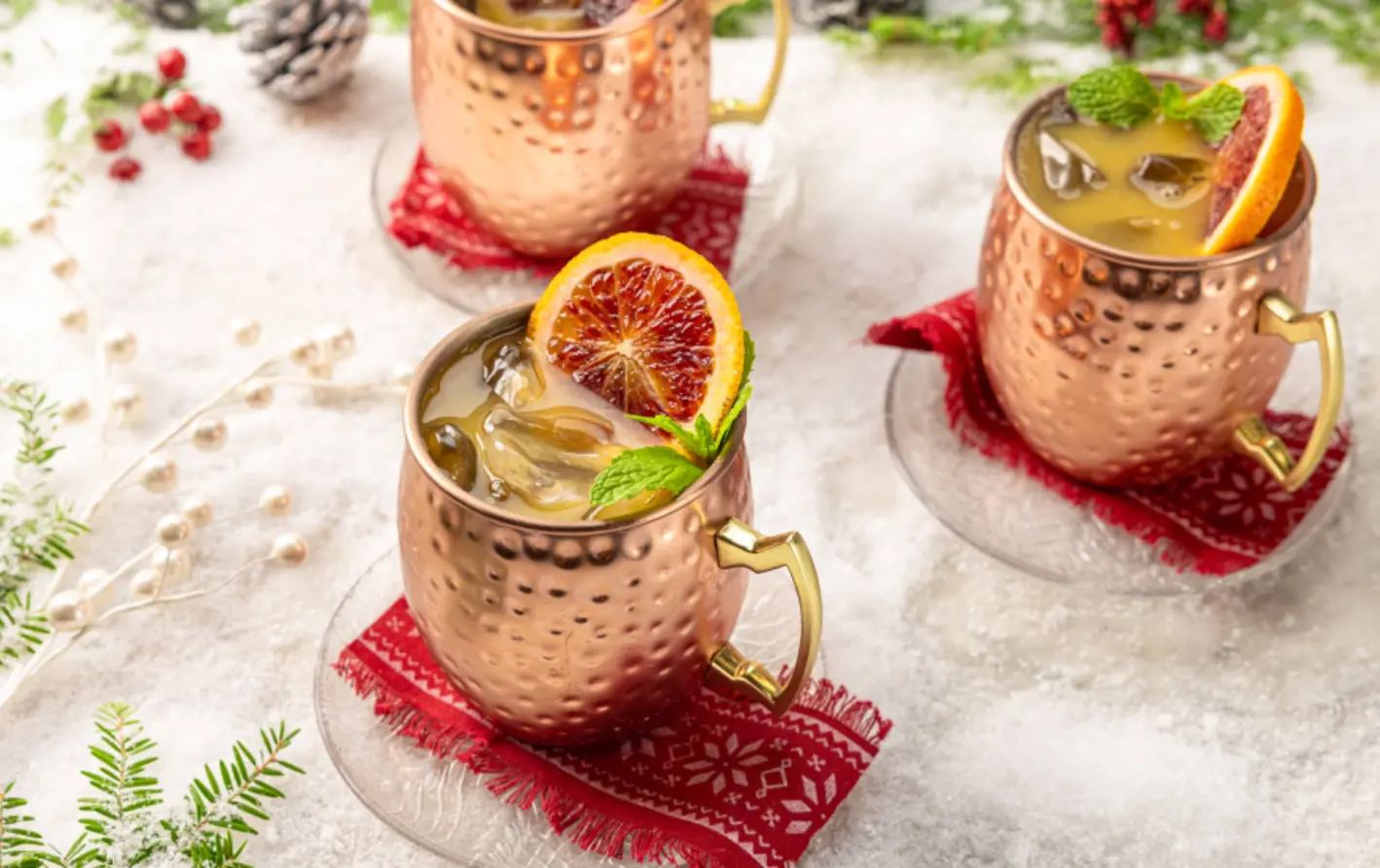 festive holiday mule cocktails in copper mugs